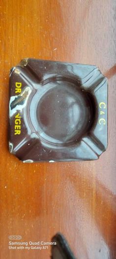 C & C Dry Ginger "ale" enamel metal ashtray ,dark brown,  very old vintage advertising ashtray, hard to come by ,collectors item,used condition  see pictures
