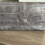 Guess purse. Never used. Slightly worn on inside due to storage. Image 2