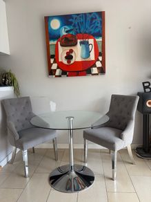 Glass table with velvet studded chairs