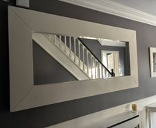 Large rectangular wall mirror with wide white frame