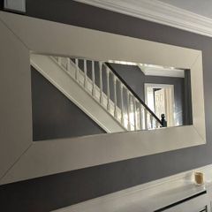 Large rectangular wall mirror with wide white frame