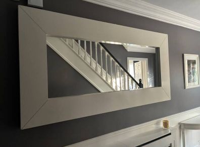 Large rectangular wall mirror with wide white frame
