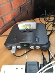 N64 with 2x Controllers along with Mario Kart/1080 Snowboarding