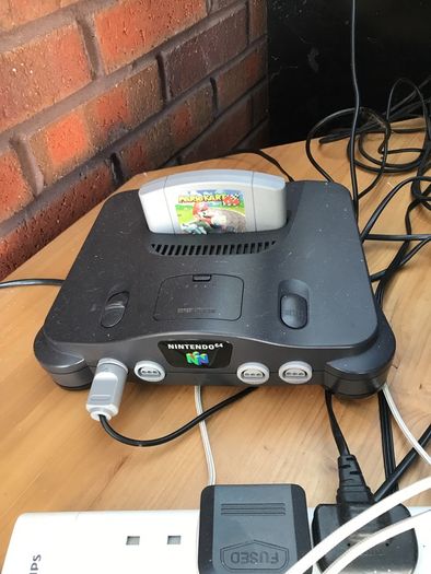 N64 with 2x Controllers along with Mario Kart/1080 Snowboarding