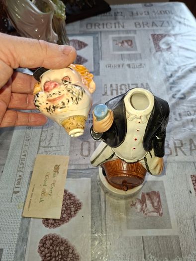 1950s to 70s Working Musical Decanter Hobo Clown Sitting on a Barrel. The base plays the tune Show Me the Way to Go Home, reminded me of the song from Jaws