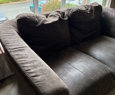 Two 2 seater couches in brown suede