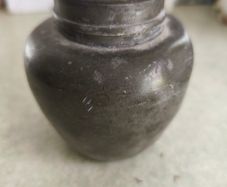 Chainse  tin tea caddy. It is an antique item, possibly from the late 19th or early 20th century.