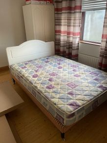 Double Bed with white headboard