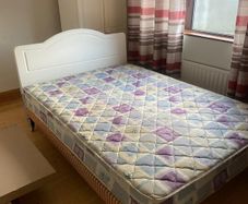 Double Bed with white headboard