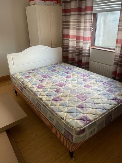 Double Bed with white headboard