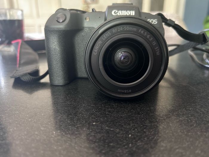 canon Camera EOS RP with 24-50 mm F4.5-6.3 IS STM. This camera has literally never been used!. My daughter bought it in Conns Cameras in Dublin City and NEVER used it. Camera and lens comes with original boxes ( as new) and the shopping bag. Camera also c