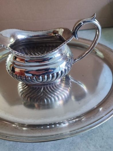 Vintage from the 19th century. Antique Period English Tea Service inc Teapot, Sugar bowl & milk jug Sheffield England on small silver plated tray.