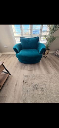 Teal love seat swivel.