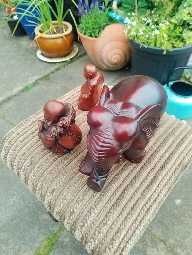 carved wooden elephant and 2 Buddha
