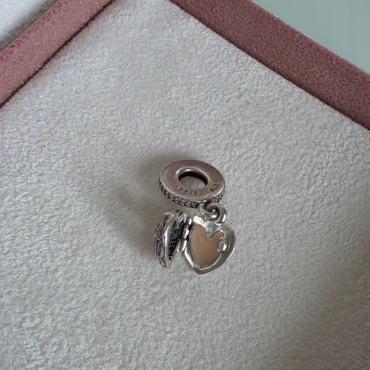Pandora locket angel wings,with enamel dangle charm very good condition