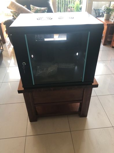 Cams wall mounted 9U cabinet with a variety of cables and connections