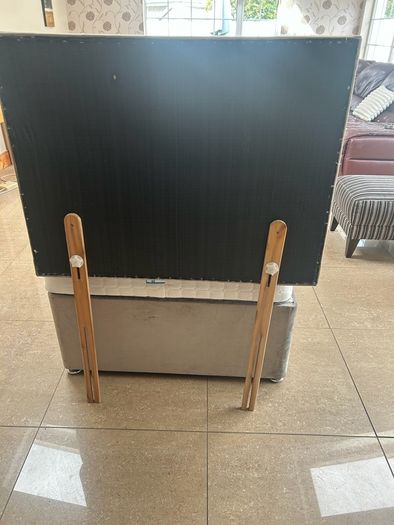 Two single beds with mattresses and headboards