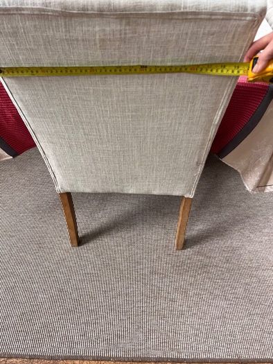Cream button backed Kitchen chairs.