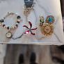 little  collection of broches,a chain and a charm  bracelet Image 4