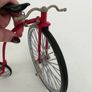 1:10 scale die-cast metal replica of a Red Penny-farthing bicycle. Image 6