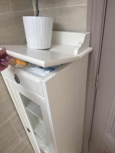 Bathroom storage in white.