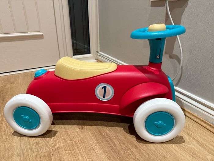 Sit upon toy ride along car