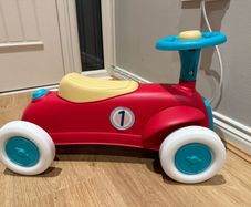 Sit upon toy ride along car