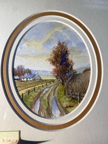 picture Country lane landscape featuring a whitewashed cottage, bare trees, and rutted track.