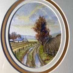 picture Country lane landscape featuring a whitewashed cottage, bare trees, and rutted track.
