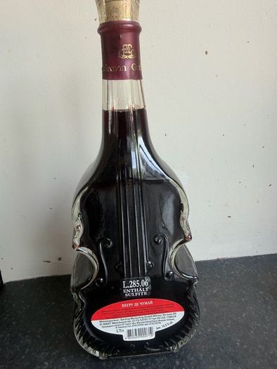 Collectors Red Wine Bottle shaped like a Stradivarius