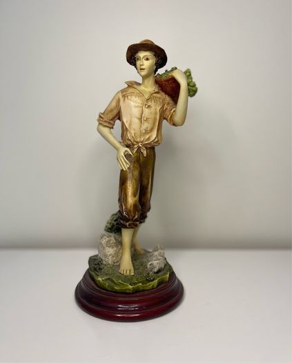 Boy with a basket figurine signed Ballester