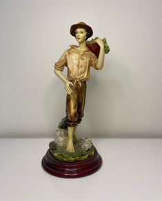 Boy with a basket figurine signed Ballester