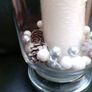 tall clear vase with white candle and decorations Image 2