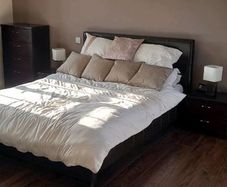 Brown leather bed