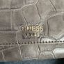 Guess purse. Never used. Slightly worn on inside due to storage. Image 3