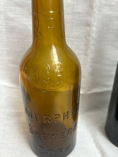 Antique Cork Advertising Bottles x2
