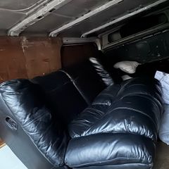 Black leather recliner sofa