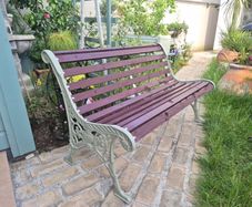 Garden bench, cast iron, beautiful design, restored seat, outdoor garden seating, treated timber decorations, furniture patio decking, great present. Ignore flowers, pots, plants, garden statue, chair, swing, patio table, balcony.