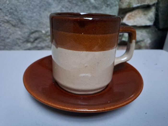 Dark and light brown cup and saucer