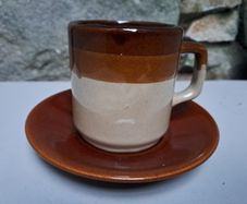 Dark and light brown cup and saucer