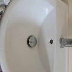 2 White pedestal sink and small radiator