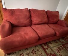 Three seater sofa in red fabric