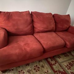 Three seater sofa in red fabric