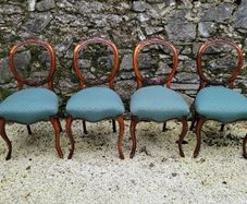19th century set of four carved walnut balloon back chairs