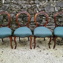 19th century set of four carved walnut balloon back chairs