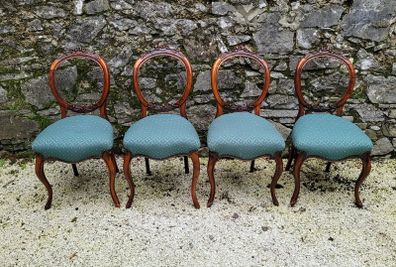 19th century set of four carved walnut balloon back chairs