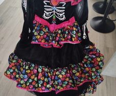 Sugar skull Halloween costume size 9-10 years old with headband included. Like new.