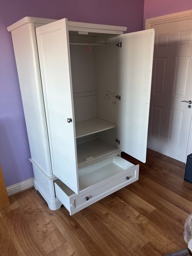 White double door high wardrobe with bottom drawer and shelf