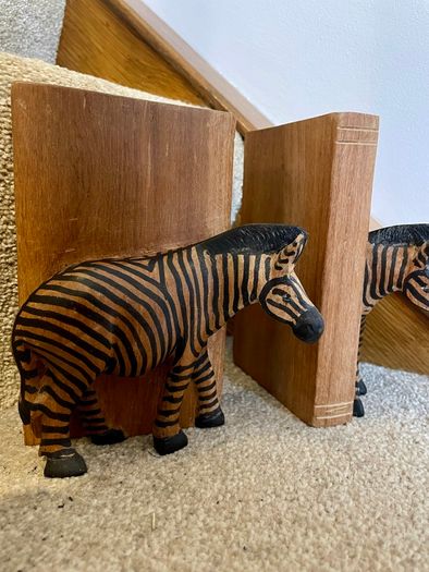 Early c20th hand-carved wooden zebra bookends