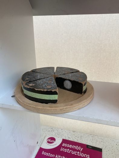 kids play kitchen by Plum with wooden food accessories